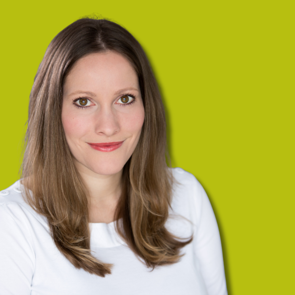 Laura Bates sat against a green background